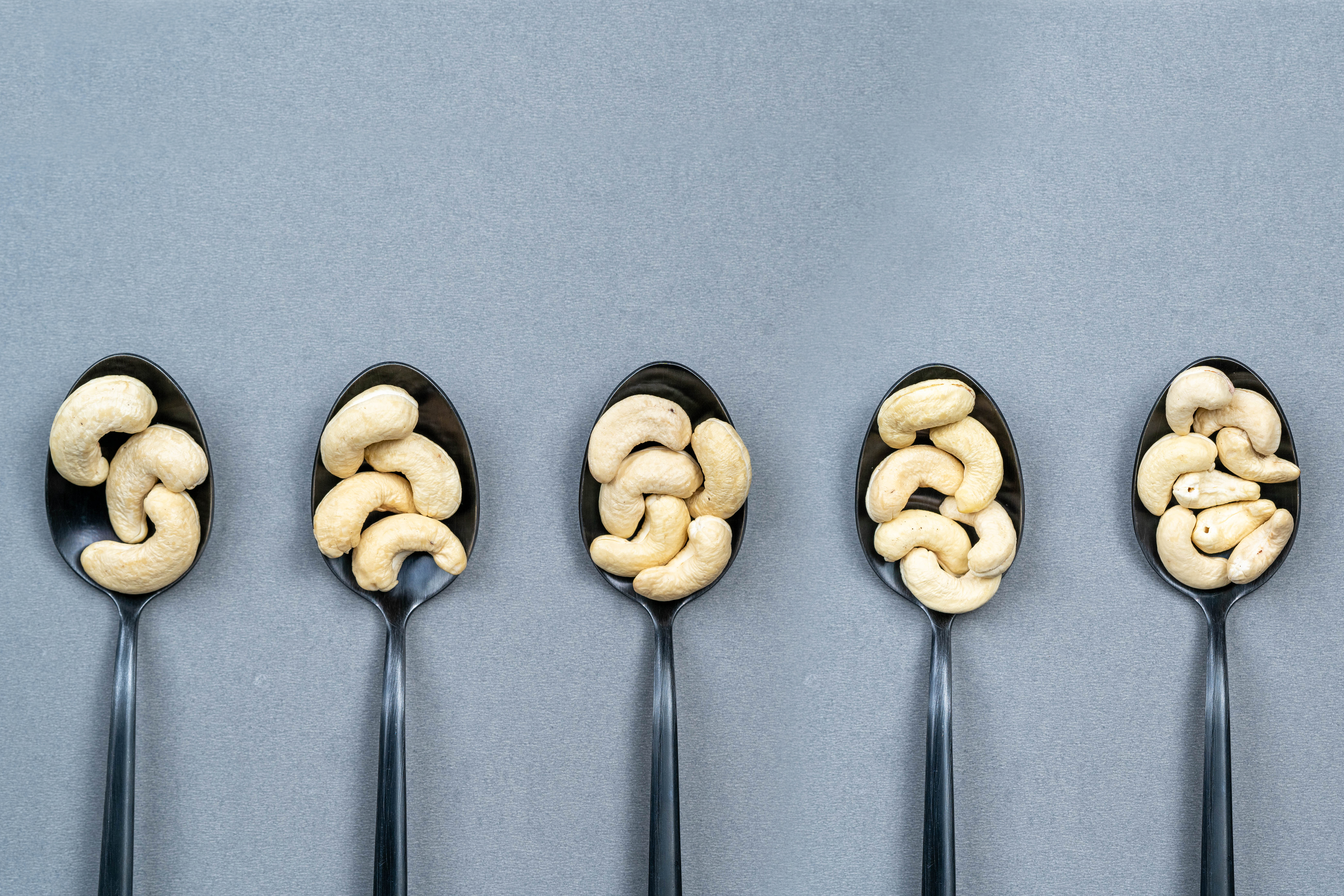 Different sizes of top 5 whole cashew grades